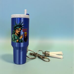 Mini tumbler-shaped keychain featuring a satirical graphic attached to a metal keyring