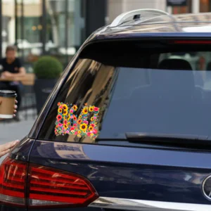 Vinyl car decal with a floral “8647” design applied to a vehicle window.