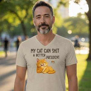 Graphic t-shirt featuring a relaxed cat illustration with a sarcastic political message
