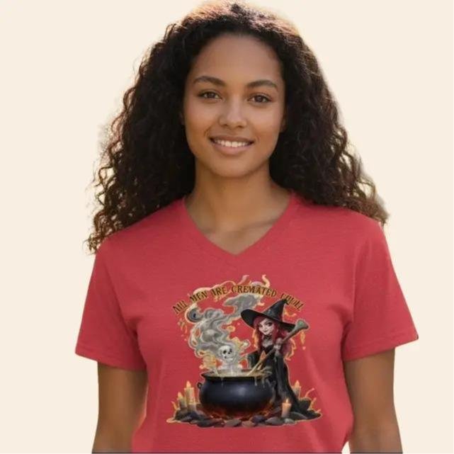 Cremated Equal Woman wearing a V-neck graphic t-shirt with a witch brewing a cauldron illustration.
