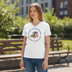 Community activism T-shirt featuring hands holding a plant and the text “It Takes a Village Politics.”