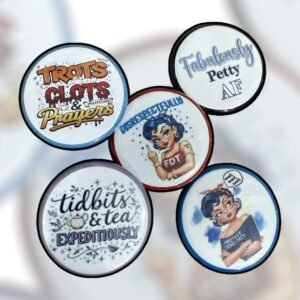 Set of round pin buttons featuring multiple illustrated designs and bold sayings from the Christina Talks Tea collaboration.