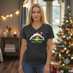 Model wearing a V-neck graphic t-shirt with a festive illustrated character and humorous holiday message.
