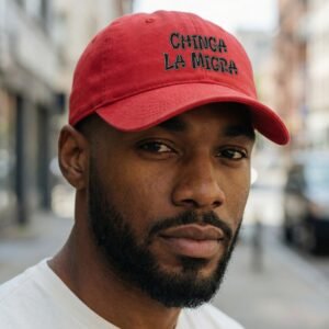 dad hat featuring the phrase “Chinga La Migra” stitched on the front.