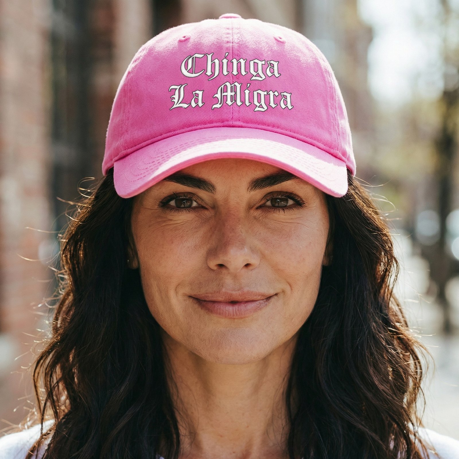 ChingaLaMigraOSHat dad hat featuring the phrase “Chinga La Migra” stitched on the front.
