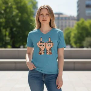 Graphic shirt reading “FUCK ICE” with illustrated raised hands breaking chains.