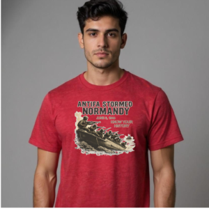 Model wearing a graphic t-shirt featuring a World War II Normandy landing illustration with historical text.