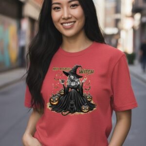 Model wearing a witch-themed graphic t-shirt with a playful illustrated design and bold lettering.
