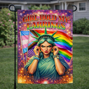 Sublimated pride garden flag with rainbow artwork, liberty-inspired figure, and Girl Hold My Earrings text displayed outdoors.