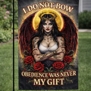 Sublimated gothic queen garden flag with wings, roses, and empowering rebellion quote displayed outdoors.