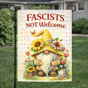 Sublimated floral gnome garden flag with “Fascists Not Welcome” message displayed outdoors.