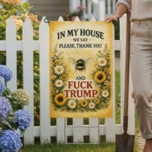 Sublimated bee floral garden flag with farmhouse quote and bold anti-Trump humor text displayed outdoors.