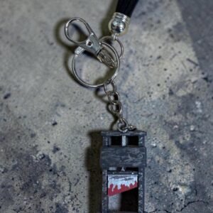Miniature guillotine keychain with detailed structure and metal clasp