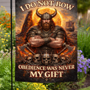 Sublimated Viking garden flag with warrior artwork, fiery Norse symbols, and rebellion quote displayed outdoors.
