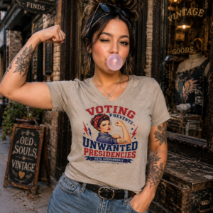 Graphic t-shirt featuring retro-inspired voting artwork with a bold political statement message.