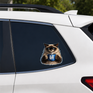Grumpy cat vinyl sticker holding a steaming coffee mug with a sarcastic political message.