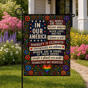 Sublimated inclusive patriotic garden flag with colorful folk-art florals and equality messages displayed outdoors.