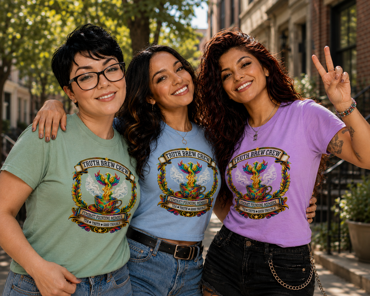 ChatGPT Image Jun 17, 2026 at 09_59_44 PM Truth Brew Crew Feminati Founding Member graphic t-shirt featuring a colorful phoenix rising from a steaming teacup with ornate decorative artwork.