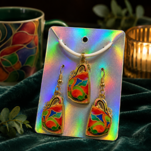 Christina's Signature Mug jewelry set featuring a matching necklace and earrings inspired by her iconic mug artwork.