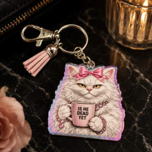 Deadly Diva cat keychain featuring a fluffy feline character with a coffee mug and decorative tassel.