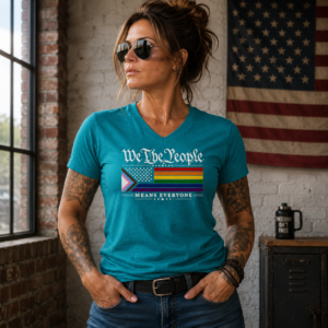 T-shirt featuring the phrase "We The People Means Everyone" with Pride-inspired flag artwork promoting equality and inclusion.