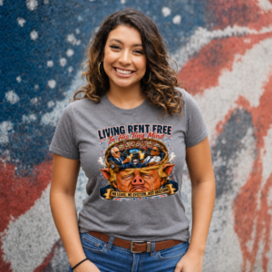 Graphic t-shirt featuring the phrase "Living Rent Free in His Tiny Mind" with a detailed satirical political illustration.