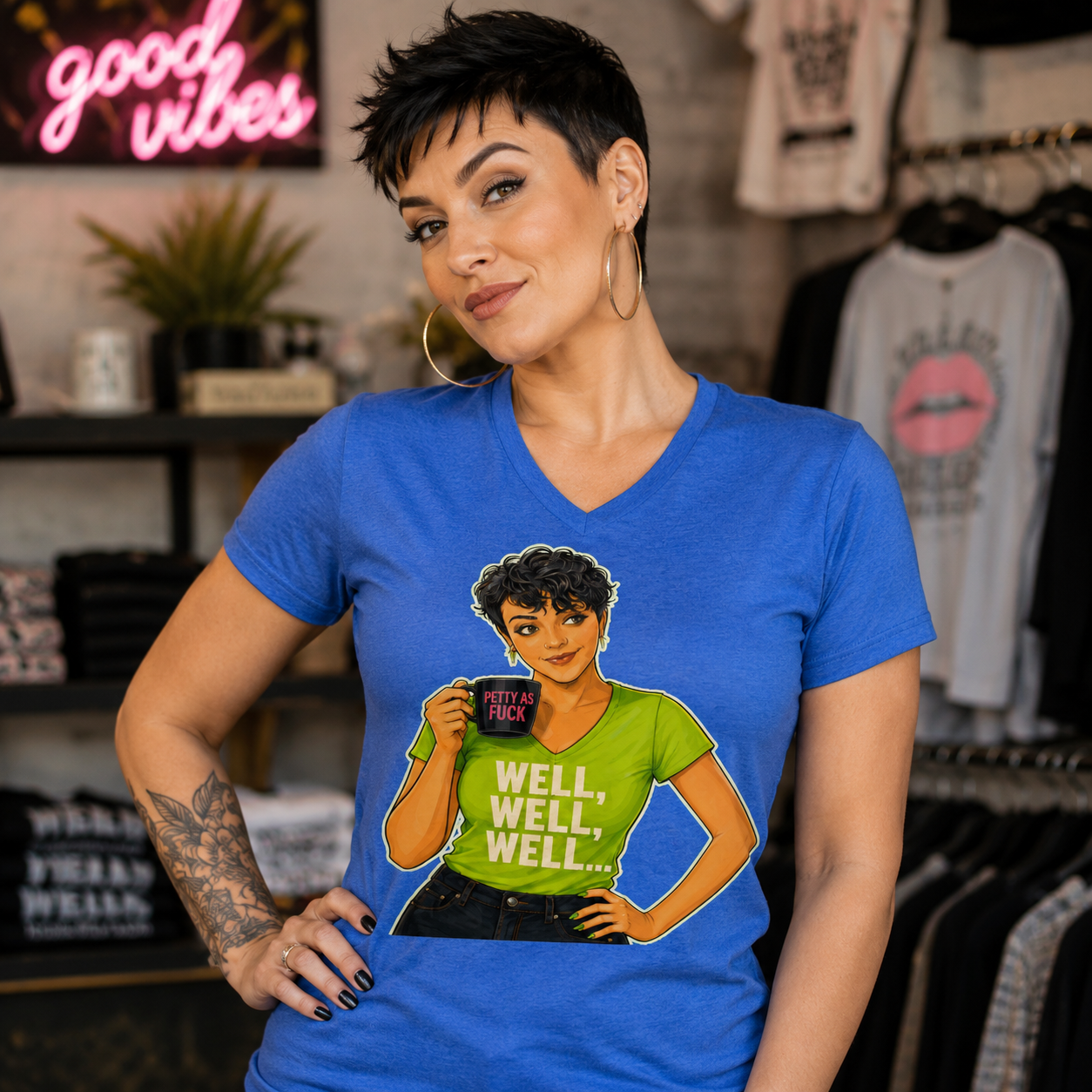 ChatGPT Image Aug 17, 2026, 10_51_38 AM Woman wearing the Not Your Podcast Christina Talks Tea t-shirt featuring an illustrated Christina holding a “Petty as Fuck” mug.