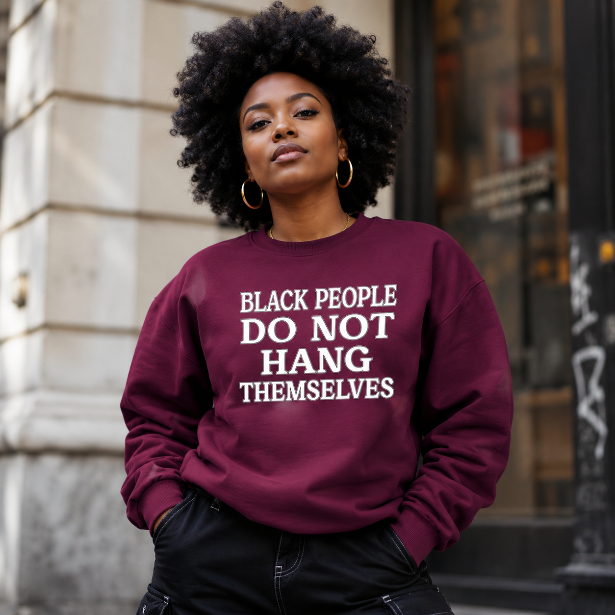 Black People Do Not Hang Themselves Crewneck Sweatshirt Woman wearing a burgundy Black People Do Not Hang Themselves crewneck sweatshirt