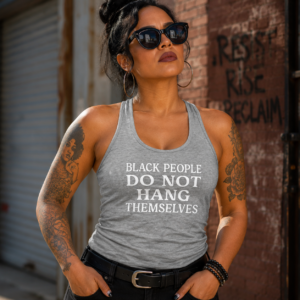 Woman wearing a gray Black People Do Not Hang Themselves relaxed racerback tank