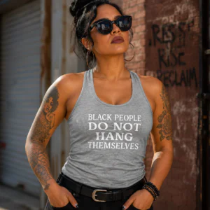 Woman wearing a gray Black People Do Not Hang Themselves relaxed racerback tank