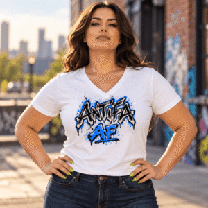 Woman wearing an Antifa AF graffiti graphic t-shirt in an outdoor urban setting.